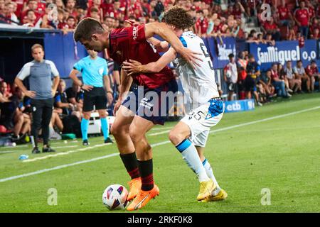 Pamplona, Spain. 24th Aug, 2023. Sports. Football/Soccer.Jesus Areso (12. CA Osasuna) and Maxim De Cuyper (55. Club Brugge ) during the football match of First leg of the UEFA Europa Conference League qualifier play-off between CA Osasuna and Club Brugge played at El Sadar stadium in Pamplona (Spain) on August 24, 2023. Credit: Inigo Alzugaray/CordonPress Credit: CORDON PRESS/Alamy Live News Stockfoto