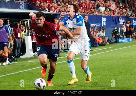 Pamplona, Spain. 24th Aug, 2023. Sports. Football/Soccer.Jesus Areso (12. CA Osasuna) and Maxim De Cuyper (55. Club Brugge ) during the football match of First leg of the UEFA Europa Conference League qualifier play-off between CA Osasuna and Club Brugge played at El Sadar stadium in Pamplona (Spain) on August 24, 2023. Credit: Inigo Alzugaray/CordonPress Credit: CORDON PRESS/Alamy Live News Stockfoto