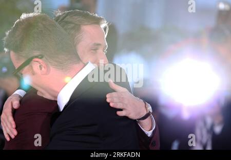 Bildnummer: 55387503  Datum: 22.05.2011  Copyright: imago/Xinhua (110522) -- CANNES, May 22, 2011 (Xinhua) -- Danish director Nicolas Winding Refn (R) receives a hug by actor Ryan Gosling during a photocall after being awarded with the Best Director for his film Drive at the 64th Cannes Film Festival in Cannes, France, on May 22, 2011. The festival ended here on Sunday night. (Xinhua/Gao Jing) (wjd) FRANCE-CANNES-FILM FESTIVAL PUBLICATIONxNOTxINxCHN Kultur Entertainment People Film 64. Internationale Filmfestspiele Cannes Photocall Preisträger kbdig xkg 2011 quer Aufmacher premiumd o0 Bester R Stock Photo