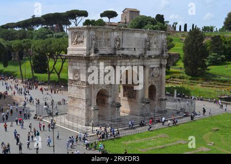 Aerial view of the iconic Arc de Triomphe monument in Paris, France, surrounded by a large crowd of people Stock Photo