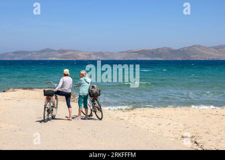 Kos, Greece - May 8, 2023: Tourists on sandy beach of Marmari. The Greek island of Kos Stock Photo