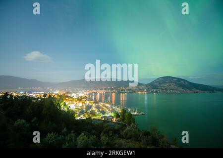 The stunning aurora borealis illuminates the night sky above Okanagan Lake Stock Photo