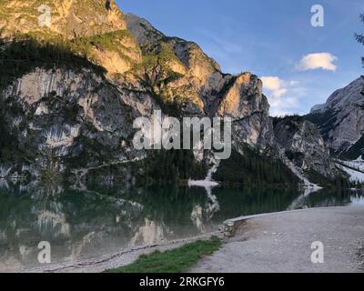 A scenic view of Lake Braies situated in the majestic Dolomites mountain range in Italy Stock Photo