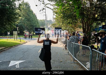 Atlanta, Ga. 24th Aug, 2023. 2023 - Opponents of former President DONALD TRUMP demonstrate during the congregation of supporters and opponents of his arrival outside the Fulton County Jail, where he is expected to turn himself in to the jail this afternoon and have his mug shot taken for the first time. Credit: Carlos Escalona/Cnp/Media Punch/Alamy Live News Stock Photo