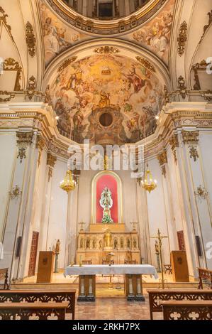 VALENCIA, SPAIN - FEBRUAR 16, 2022: The baroque presbytery with the fresco with Lamb of God , St. Peter and Andrew in the church San Juan de la Cruz Stock Photo