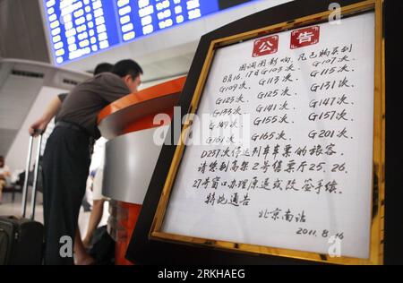 Bildnummer: 55781463  Datum: 16.08.2011  Copyright: imago/Xinhua (110816) -- BEIJING, Aug. 16, 2011 (Xinhua) -- Passengers change tickets at Beijing South Railway Station in Beijing, capital of China, Aug. 16, 2011. The new schedules for Beijing-Tianjin and Beijing-Shanghai high-speed railway were implemented on Tuesday. High-speed trains running on line between Beijing and Tianjin will run at 300 km per hour instead of 350 km per hour. High-speed trains running between Beijing and Shanghai were cut to 66 pairs from 88 pairs per day. (Xinhua/Wan Xiang)(mcg) CHINA-RAILWAY-NEW OPERATION SCHEDULE Stock Photo