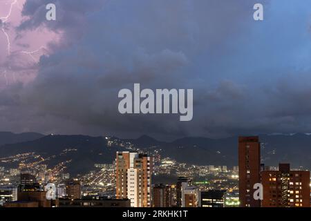 An aerial view of the city of Medellin, Colombia, at night during a thunderstorm Stockfoto