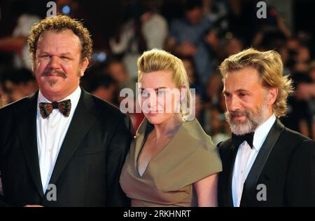 110901 -- VENICE, Sept. 1, 2011 Xinhua -- Actor John C. Reilly, actress Kate Winslet and actor Christoph Waltz L to R pose on the red carpet before the premiere of the Roman Polanski film Carnage at the 68th Venice International Film Festival in Venice, Italy, Sept. 1, 2011. Xinhua/Wang Qingqin ITALY-VENICE-FILM FESTIVAL- CARNAGE -PREMIERE PUBLICATIONxNOTxINxCHN Stock Photo