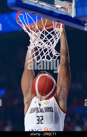 Okinawa, Japan. 25th Aug, 2023. Germany's Johannes Thiemann dunks during the group E first round match between Germany and Japan at the FIBA World Cup 2023 in Okinawa, Japan, Aug. 25, 2023. Credit: Zhang Xiaoyu/Xinhua/Alamy Live News Stock Photo