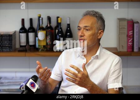 (230825) -- IZMIR, Aug. 25, 2023 (Xinhua) -- Umay Ceviker, a wine enthusiast and boutique producer based in Ankara, speaks in an interview with Xinhua in Ankara, T¨¹rkiye, Aug. 23, 2023.  The Aegean region of T¨¹rkiye is a wine lover's paradise. With its idyllic climate and terrain perfectly suited for winemaking, the region is home to more than half of the country's wine production.    TO GO WITH 'Feature: T¨¹rkiye's Aegean vineyards attract wine lovers across world' (Mustafa Kaya/Handout via Xinhua) Stock Photo