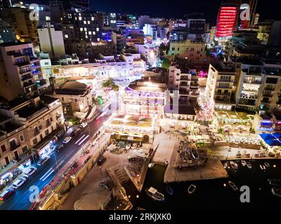 An Aerial drone night shot of St. Julian's Bay in Malta Stockfoto