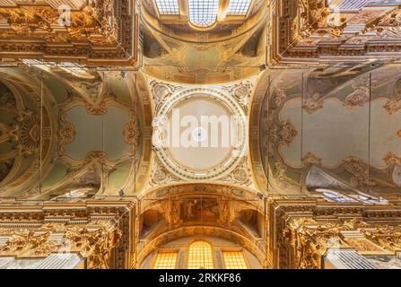 GENOVA, ITALY - MARCH 8, 2023: The cupola and ceiling of baroque church Chiesa dei Santi Vittore e Carlo. Stock Photo