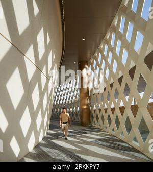 Circulation corridor with screen. 360 Mall, Kuweit City, Kuwait. Architect: CRTKL, 2021. Stock Photo