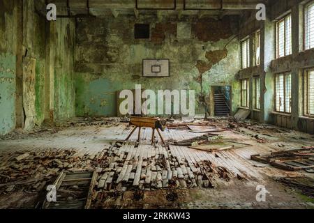 Abandoned Sports Court of Palace of Culture Building at Duga Radar Village - Chernobyl Exclusion Zone, Ukraine Stock Photo