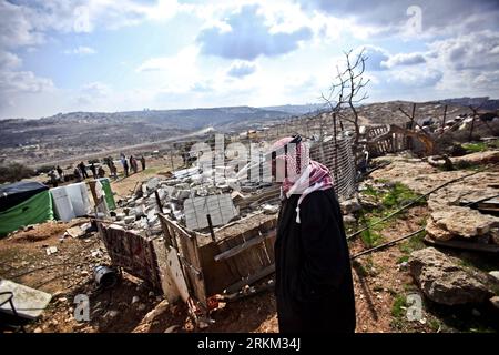 Bildnummer: 56429751  Datum: 24.11.2011  Copyright: imago/Xinhua (111124) -- BIET HANENA, Nov. 24, 2011 (Xinhua) -- A Palestinian man surveys remains of his destroyed house in the West Bank village of Biet Hanena near the city of Ramallah, on Nov. 24, 2011. Israeli troops demolished four houses of Bedouin residents in the West Bank under the pretext of not having building permits on Thursday.(Xinhua/Fadi Arouri)(wn) MIDEAST-WEST BANK-DEMOLISHMENT PUBLICATIONxNOTxINxCHN Politik Gesellschaft Westjordanland Nahostkonflikt Zerstörung Wohnhaus xjh x0x premiumd 2011 quer      56429751 Date 24 11 201 Stock Photo