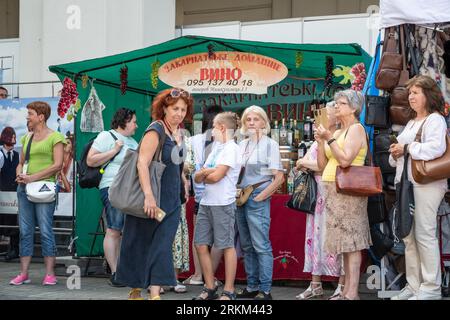 People seen at the National Sorochynskyi Fair. On Ukraine's Independence Day, people in national Ukrainian clothes visit the National Sorochynskyi Fair and watch performances by folklore ensembles in Lviv. The Fair traditionally takes place every year in Velyki Sorochyntsy in the Poltava region, the Fair is held in Lviv for the first time in history due to the war. Stock Photo