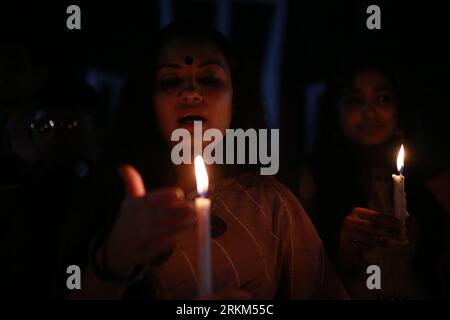 DHAKA, BANGLADESH-MARCH 8, 2021: Women take part in a candle light vigil to mark International Women's Day in Dhaka, Bangladesh on March 8, 2021. International Women's Day is a global day observed on March 8 every year, celebrating the social and political achievements of women. Stock Photo