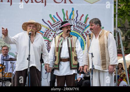 Lviv, Ukraine. 24th Aug, 2023. Men in national Ukrainian clothes perform at the folklore festival. On Ukraine's Independence Day, people in national Ukrainian clothes visit the National Sorochynskyi Fair and watch performances by folklore ensembles in Lviv. The Fair traditionally takes place every year in Velyki Sorochyntsy in the Poltava region, the Fair is held in Lviv for the first time in history due to the war. (Photo by Olena Znak/SOPA Images/Sipa USA) Credit: Sipa USA/Alamy Live News Stock Photo