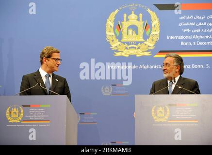 Bildnummer: 56635638  Datum: 05.12.2011  Copyright: imago/Xinhua (111206) -- BONN, Dec. 6, 2011 (Xinhua) -- German Foreign Minister Guido Westerwelle (L) and Afghan Foreign Minister Zalmay Rassoul attend a press conference in Bonn, Germany, Dec. 5, 2011. The 2011 Bonn conference, hosted by Germany and chaired by Afghan President Hamid Karzai, pledged sustained support to Afghanistan for another decade after NATO combat troops are withdrawn from the country in 2014. (Xinhua/Ma Ning) (zf) GERMANY-BONN-CONFERENCE-AFGHANISTAN PUBLICATIONxNOTxINxCHN People Politik Konferenz Afghanistankonferenz PK Stock Photo