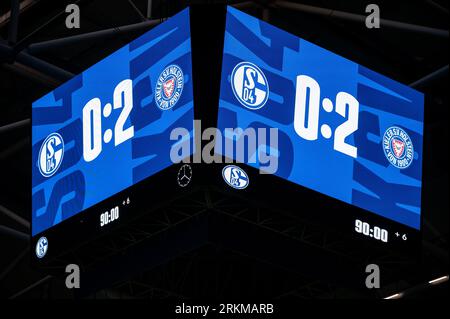 Gelsenkirchen, Germany. 25th Aug, 2023. Soccer: 2. Bundesliga, FC Schalke 04 - Holstein Kiel, Matchday 4, Veltins Arena. The final score of 0:2 is shown on the display in the stadium. Credit: Fabian Strauch/dpa - IMPORTANT NOTE: In accordance with the requirements of the DFL Deutsche Fußball Liga and the DFB Deutscher Fußball-Bund, it is prohibited to use or have used photographs taken in the stadium and/or of the match in the form of sequence pictures and/or video-like photo series./dpa/Alamy Live News Stock Photo