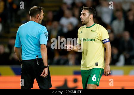 Bristol City's Matthew James interacts with referee James Linington (left) during the Sky Bet Championship match at the MKM Stadium, Hull. Picture date: Friday August 25, 2023. Stock Photo