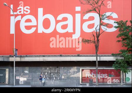 Madrid, Spain. 2nd Aug, 2023. Pedestrians walk past the Spanish biggest department store El Corte Ingles as above them hangs a large Summer sale season (Rebajas in Spanish) billboard in Spain. (Credit Image: © Xavi Lopez/SOPA Images via ZUMA Press Wire) EDITORIAL USAGE ONLY! Not for Commercial USAGE! Stock Photo