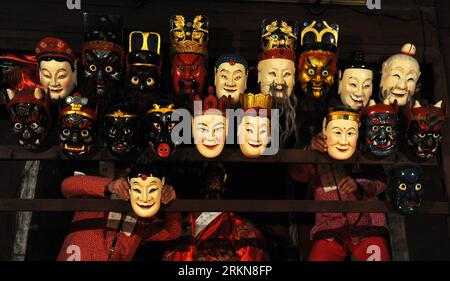 Bildnummer: 57032745  Datum: 08.02.2012  Copyright: imago/Xinhua (120208) -- NANFENG, Feb. 8, 2012 (Xinhua) -- Masks used for Nuo dance are collected after a performance at Miaoqian Village in Nanfeng County, east China s Jiangxi Province, Feb. 8, 2012. As a centuried tradition, villagers here usually perform the Nuo dance for 18 days from the beginning of Chinese Lunar New Year. It is a sacrificial ritual for locals to expel evil spirits and pray for blessings and harvests. (Xinhua/Zhou Ke)(bxy/hdt) CHINA-JIANGXI-TRADITIONAL NUO DANCE (CN) PUBLICATIONxNOTxINxCHN Gesellschaft Kultur Tanz Tradi Stock Photo