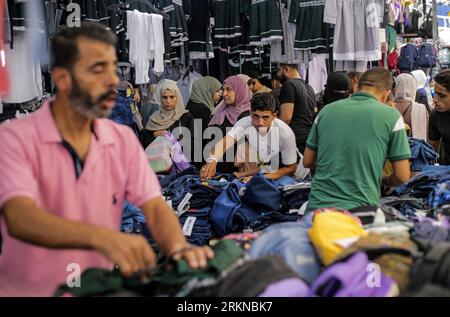 Gaza, Palestine. 25th Aug, 2023. Palestinians shop during the preparation for the new academic year in the market in Gaza city. (Credit Image: © Mahmoud Issa/SOPA Images via ZUMA Press Wire) EDITORIAL USAGE ONLY! Not for Commercial USAGE! Stock Photo