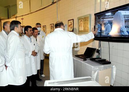 Bildnummer: 57076892  Datum: 15.02.2012  Copyright: imago/Xinhua (120215)-- TEHRAN, Feb. 15, 2012 (Xinhua) -- Iranian President Mahmoud Ahmadinejad (2nd, L) attends an unveiling ceremony of a new generation of centrifuge for uranium enrichment in Tehran, Iran, Feb. 15, 2012. In the ceremony, Ahmadinejad, symbolically, fed a home-made fuel rod made out of 20-percent enriched uranium into the core of Tehran Research Reactor. (Xinhua/Official Website of the Iranian President) IRAN-TEHRAN-NUCLEAR-AHMADINEJAD PUBLICATIONxNOTxINxCHN People Politik AKW Zentrifuge Nukleartechnik Atomprogramm Atomstrei Stock Photo