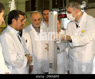 Bildnummer: 57076890  Datum: 15.02.2012  Copyright: imago/Xinhua (120215)-- TEHRAN, Feb. 15, 2012 (Xinhua) -- Iranian President Mahmoud Ahmadinejad (2nd, L) attends an unveiling ceremony of a new generation of centrifuge for uranium enrichment in Tehran, Iran, Feb. 15, 2012. In the ceremony, Ahmadinejad, symbolically, fed a home-made fuel rod made out of 20-percent enriched uranium into the core of Tehran Research Reactor. (Xinhua/Official Website of the Iranian President) IRAN-TEHRAN-NUCLEAR-AHMADINEJAD PUBLICATIONxNOTxINxCHN People Politik AKW Zentrifuge Nukleartechnik Atomprogramm Atomstrei Stock Photo