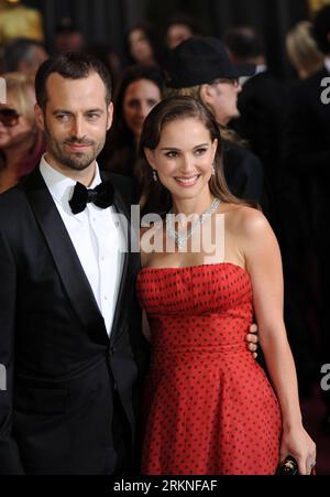 (120227) -- HOLLYWOOD, Feb. 26, 2012 (Xinhua) -- Actress Natalie Portman (R) and Actor Benjamin Millepied arrive on the red carpet for the 84th Annual Academy Awards in Hollywood, California, the United States, Feb. 26, 2012. (Xinhua/Yang Lei)(msq) U.S.-HOLLYWOOD-OSCARS-RED CARPET PUBLICATIONxNOTxINxCHN   Hollywood Feb 26 2012 XINHUA actress Natalie Portman r and Actor Benjamin  Arrive ON The Red Carpet for The 84th Annual Academy Awards in Hollywood California The United States Feb 26 2012 XINHUA Yang Lei msq U S Hollywood Oscars Red Carpet PUBLICATIONxNOTxINxCHN Stock Photo