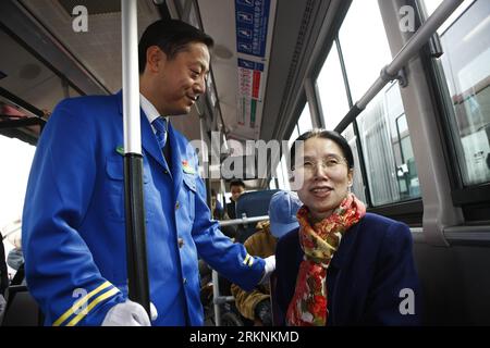 Bildnummer: 57266459  Datum: 07.03.2012  Copyright: imago/Xinhua (120307) -- BEIJING, March 7, 2012 (Xinhua) -- Photo taken on Feb. 29, 2012 shows Yang Jia (R, front), a blind professor of the Chinese Academy of Sciences and a member of the 11th National Committee of the Chinese People s Political Consultative Conference (CPPCC), sits in a wheelchair-accessible bus in Beijing, capital of China. Yang, who lost her eyesight at the age of 29, devoted herself to the pursuit of rights of with disabilities. (Xinhua/Wan Xiang) (llp) (TWO SESSIONS)CHINA-BEIJING-CPPCC-MEMBER-YANG JIA (CN) PUBLICATIONxN Stock Photo