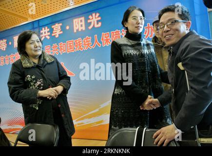 Bildnummer: 57266462  Datum: 07.03.2012  Copyright: imago/Xinhua (120307) -- BEIJING, March 7, 2012 (Xinhua) -- Photo taken on Feb. 27, 2012 shows Yang Jia (2nd L), a blind professor of the Chinese Academy of Sciences and a member of the 11th National Committee of the Chinese People s Political Consultative Conference (CPPCC), attending a seminar in Beijing, capital of China. Yang, who lost her eyesight at the age of 29, devoted herself to the pursuit of rights of with disabilities. (Xinhua/Wang Jianhua) (llp) (TWO SESSIONS)CHINA-BEIJING-CPPCC-MEMBER-YANG JIA (CN) PUBLICATIONxNOTxINxCHN People Stock Photo