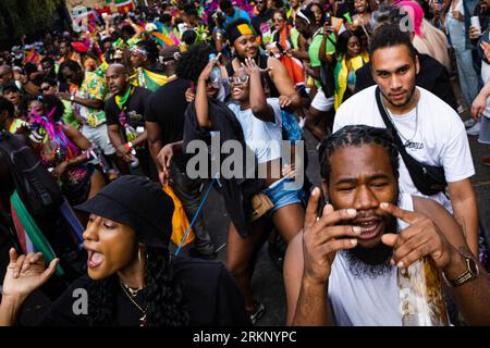 London, UK. 30th Aug, 2022. A large group of spectators joined the celebration of the event. After 2 years of pandemic, the biggest street party in Europe, Notting Hill Carnival returned in 2022, being the 54th carnival since 1966. It is expected that there are 2 million attendees at Carnival plus 40,000 volunteers and 9,000 police. (Credit Image: © Daniel Lai/SOPA Images via ZUMA Press Wire) EDITORIAL USAGE ONLY! Not for Commercial USAGE! Stock Photo