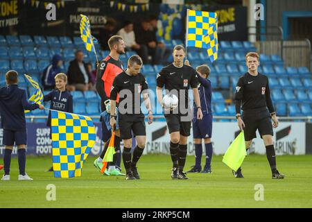 Armco Arena, Solihull, UK, 25th Aug 2023, referees enter pitch during Vanarama National League match between Solihull Moors FC and FC Halifax Town held at Solihull Moors Armco Arena Credit: Nick Phipps/Alamy Live News Stock Photo