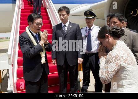 Bildnummer: 58096845  Datum: 12.06.2012  Copyright: imago/Xinhua (120612) -- PHNOM PENH, June 12, 2012 (Xinhua) -- He Guoqiang (1st L), a member of the Standing Committee of the Political Bureau of the Communist Party of China (CPC) Central Committee and secretary of the CPC Central Commission for Discipline Inspection, is greeted upon his arrival in Phnom Penh, capital of Cambodia, June 12, 2012. He Guoqiang arrived here Tuesday for an official good-will visit. (Xinhua/Huang Jingwen) (lmm) CAMBODIA-PHNOM PENH-CHINA-HE GUOQIANG-ARRIVAL PUBLICATIONxNOTxINxCHN People Politik x0x xst 2012 quer Stock Photo