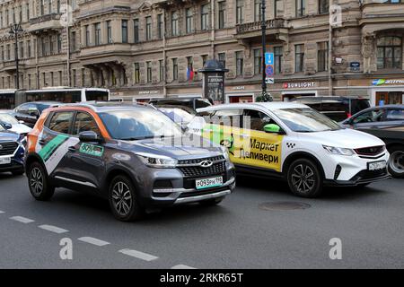 Saint Petersburg, Russia. 25th Aug, 2023. A rental car with the inscription Delimobil and a car Market Delivery drive along Nevsky Prospekt, in the very center of Saint Petersburg. Credit: SOPA Images Limited/Alamy Live News Stock Photo