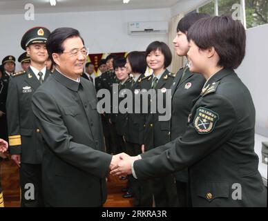 Bildnummer: 58162304  Datum: 29.06.2012  Copyright: imago/Xinhua (120629) -- HONG KONG, June 29, 2012 (Xinhua) -- Chinese President Hu Jintao (L, front), who is also general secretary of the Central Committee of the Communist Party of China and chairman of the Central Military Commission, shakes hands with a soldier of the Chinese People s Liberation Army (PLA) Garrison in the Hong Kong Special Administrative Region (HKSAR) at the Shek Kong barracks in Hong Kong, south China, June 29, 2012. (Xinhua/Liu Weibing) (lfj) CHINA-HONG KONG-15TH ANNIVERSARY-HU JINTAO-PLA GARRISON-INSPECTION (CN) PUBLI Stock Photo