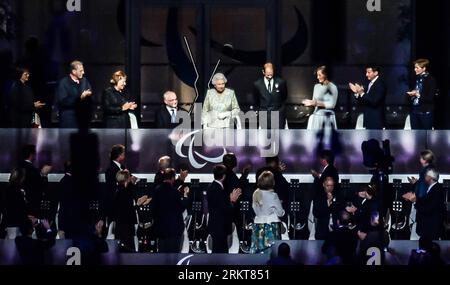 Bildnummer: 58403077  Datum: 29.08.2012  Copyright: imago/Xinhua (120830) -- LONDON, Aug. 30, 2012 (Xinhua) -- British Queen Elizabeth II (above C) attends the opening ceremony of the London 2012 Paralympic Games in London, Britain, Aug. 29, 2012. (Xinhua/Wang Haofei) (lm) BRITAIN-LONDON-PARALYMPICS-OPENING CEREMONY PUBLICATIONxNOTxINxCHN People Adel UK England Paralympics London Sommerspiele Sommer Spiele Behindertensport Behinderung Eröffnungsfeier xns x0x 2012 quer premiumd      58403077 Date 29 08 2012 Copyright Imago XINHUA  London Aug 30 2012 XINHUA British Queen Elizabeth II above C Att Stock Photo