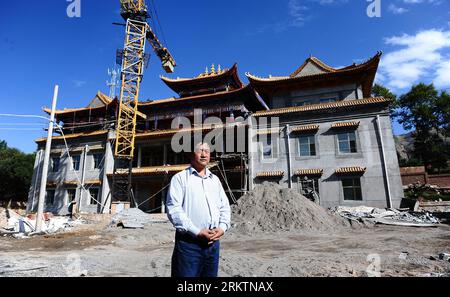 Bildnummer: 58520769  Datum: 22.09.2012  Copyright: imago/Xinhua (120927) -- HUANGNAN, Sept. 27, 2012 (Xinhua) -- A Tangka artist Quzhi stands in front of an art gallery under construction, which cost him 5 million yuan ( 793,000 U.S. dollars) in Tongren County, in Tibetan Autonomous Prefecture of Huangnan, southwest China s Qinghai Province, Sept. 22, 2012. Tongren County is also known as The village of Regong Art , which mainly consists of Buddhist painting and model-making arts, such as Tangka, embossed embroidery and clay sculpture. Although the art was originated in monastery, it has been Stock Photo