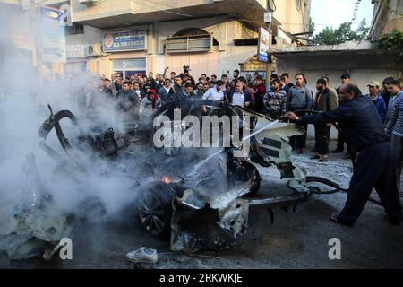 Bildnummer: 58702738  Datum: 14.11.2012  Copyright: imago/Xinhua (121115) -- GAZA, Nov. 15, 2012 (Xinhua) -- Emergency services extinguish the destroyed car of Ahmed al-Jaabari after an Israeli air strike in Gaza City on Nov. 14 2012. The head of the armed wing of Islamic Hamas movement, Ahmed al-Jaabari, was killed along with another escort in an Israeli airstrike on their car Wednesday afternoon in Gaza City, Hamas and medical sources said. (Xinhua/Wissam Nassar) MIDEAST-PALESTINE-GAZA-AIRSTRIKE-HAMAS-LEADER-KILLED PUBLICATIONxNOTxINxCHN Politik Angriff Raketenangriff ISR Nahost Nahostkonfli Stock Photo