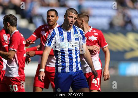 Wigan, UK. 26th Aug, 2023. Charlie Hughes #6 of Wigan Athletic is given a red card during the Sky Bet League 1 match Wigan Athletic vs Barnsley at DW Stadium, Wigan, United Kingdom, 26th August 2023 (Photo by Mark Cosgrove/News Images) in Wigan, United Kingdom on 8/26/2023. (Photo by Mark Cosgrove/News Images/Sipa USA) Credit: Sipa USA/Alamy Live News Stock Photo