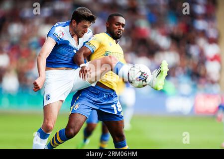 Gillingham's Ashley Nadesan and Colchester's Mandela Egbo battle for the ball during the Sky Bet League Two match at Priestfield Stadium, Gillingham. Picture date: Saturday August 26, 2023. Stock Photo