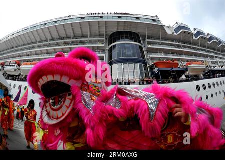 Bildnummer: 59360141  Datum: 16.03.2013  Copyright: imago/Xinhua (130316) -- HONG KONG, March 16, 2013 (Xinhua) -- Passengers aboard the cruise ship GTS Millennium watch a lion dance performance at the Kai Tak Cruise Terminal in south China s Hong Kong, March 16, 2013. GTS Millennium arrived at Hong Kong s Kai Tak Cruise Terminal on Saturday and became the first cruise ship to berth at the terminal prior to its official opening in June 2013. (Xinhua/Chen Xiaowei) (lmm) CHINA-HONG KONG-KAI TAK CRUISE TERMINAL-GTS MILLENNIUM-ARRIVAL (CN) PUBLICATIONxNOTxINxCHN Gesellschaft Verkehr Schiff Kreuzfa Stock Photo