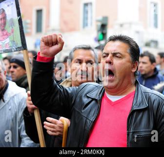 Bildnummer: 59446529  Datum: 26.03.2013  Copyright: imago/Xinhua (130326) -- LISBON, March 26, 2013 (Xinhua) -- Protesters participate in a demonstration in central Lisbon, March 26, 2013. Some 500 workers of Portugal s Viana de Castelo Shipyard arrive by bus Tuesday in downtown capital Lisbon, protesting in the rain against government s privatization of their plant. The shipyard, located in the port city of Viana de de Castelo in northern Portugal, was established in 1944 under the administration of the country s Defense Ministry. (Xinhua/Zhang Liyun) PORTUGAL-LISBON-SHIPYARD-PROTEST PUBLICAT Stock Photo