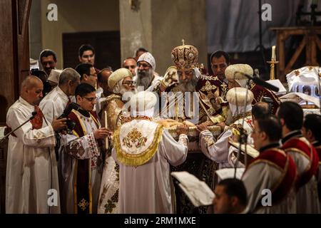 Bildnummer: 59602231  Datum: 04.05.2013  Copyright: imago/Xinhua (130504) -- CAIRO, May 4, 2013 (Xinhua) -- Pope Tawadros II (C) blesses the holy bread in Abbasiya Cathedral seat of the Coptic Orthodox Church in Cairo, May 4, 2013. Egyptian Coptic Christians are celebrating the Coptic Easter Saturday led by Pope Tawadros II as head of Egypt s Coptic Church for the first time after his election. (Xinhua/Amru Salahuddien) EGYPT-CAIRO-COPIC EASTER PUBLICATIONxNOTxINxCHN Gesellschaft People Kultur Religion Ostern Orthoxe Christen Fest Feiertag premiumd x0x xmb 2013 quer      59602231 Date 04 05 20 Stock Photo