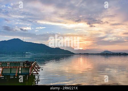 Srinagar, India. 26th Aug, 2023. A couple rests on the jetty during sunset in Srinagar, the summer capital of Jammu and Kashmir. (Photo by Saqib Majeed/SOPA Images/Sipa USA) Credit: Sipa USA/Alamy Live News Stock Photo