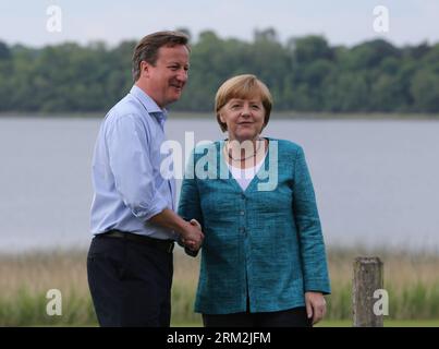 Bildnummer: 59847584  Datum: 17.06.2013  Copyright: imago/Xinhua (130618) -- FERMANAGH,  2013 (Xinhua) -- Britain s Prime Minister David Cameron (L) shakes hands with German Chancellor Angela Merkel during the official welcome as world leaders arrive for the openning ceremony of the G8 Summit at the Lough Erne resort near Enniskillen in Northern Ireland June 17, 2013. The focus of the Group of Eight (G8) industrialized nations annual summit were expected to be on Syria and economic issues. (Xinhua/Yin Gang) UK-G8-SUMMIT-OPENING PUBLICATIONxNOTxINxCHN People Politik G8 G 8 Gipfel Nordirland Fer Stock Photo