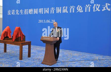 Bildnummer: 59914091  Datum: 28.06.2013  Copyright: imago/Xinhua (120628) -- BEIJING, June 28, 2013 (Xinhua) -- Francois-Henri Pinault, CEO of PPR Foundation and the owner of two bronze animal head sculptures, addresses a handover ceremony of the heads plundered by western invaders one-and-a-half centuries ago in Beijing, capital of China, June 28, 2013. The heads of a rat and a rabbit, parts of a fountain clock that previously stood at the Old Summer Palace, or Yuanmingyuan in Chinese, were donated on April 26, 2013 by the Pinault family, which owns the French luxury brand Kering. The handove Stock Photo