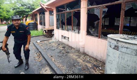 Bildnummer: 60037569  Datum: 07.07.2013  Copyright: imago/Xinhua (130707) -- BODHGAYA, July 7, 2013 (Xinhua) -- A security officer inspects the site of an explosion on the campus of the Mahabodhi Temple, the Buddhist Great Awakening temple, in Bodhgaya, about 130 kilometers (80 miles) south of Patna, the capital of the eastern Indian state of Bihar, July 7, 2013. A series of small blasts hit three Buddhist temples in eastern India early Sunday, injuring at least two people, police said. (Xinhua)(xzj) INDIA-BODHGAYA-BLAST PUBLICATIONxNOTxINxCHN Gesellschaft Explosion premiumd xsp x2x 2013 quer Stock Photo